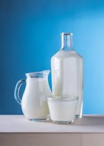 a glass jug and a glass of milk