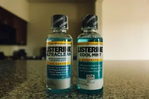 two bottles of mouthwash on a counter