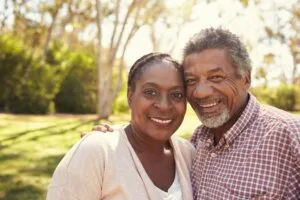 a man and woman smiling at camera