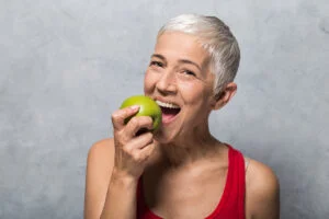 a woman eating an apple