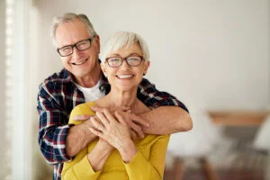 a man and woman hugging each other