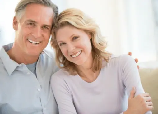 a man and woman smiling