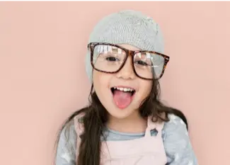 a girl wearing glasses and a hat