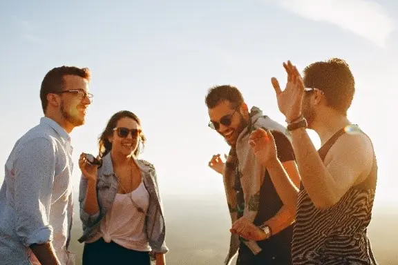 a group of people standing on a hill