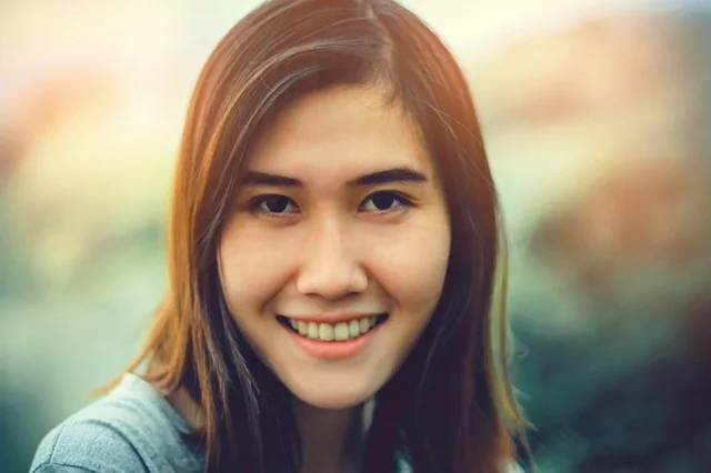 a woman smiling at the camera