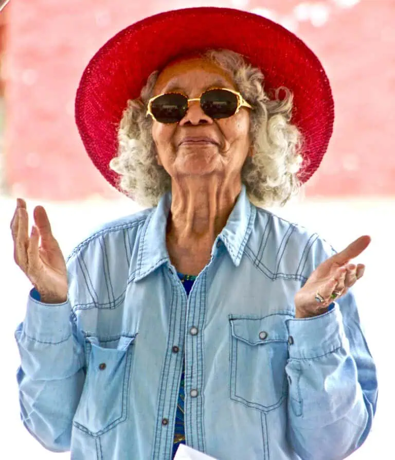 a woman wearing a red hat and sunglasses