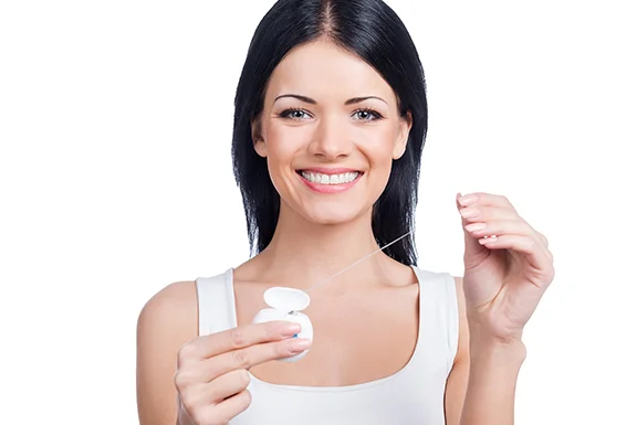 a woman holding a floss