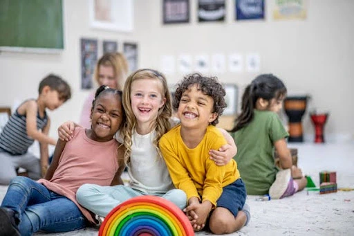 a group of children sitting on the floor