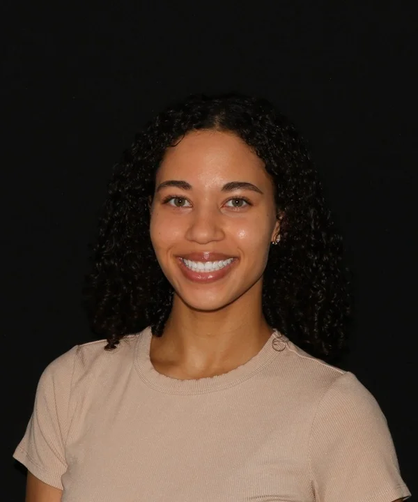 a woman smiling at the camera