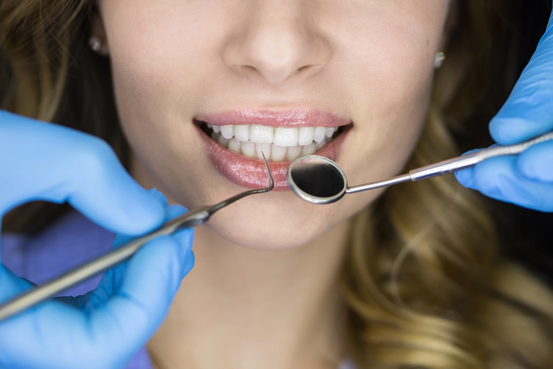 a woman with a dentist tool