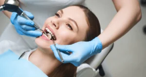Woman receiving root canal treatment from dentist in clinic in Harrisburg, NC