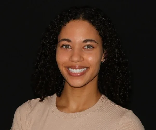 a woman smiling at the camera