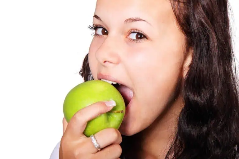 a woman eating an apple
