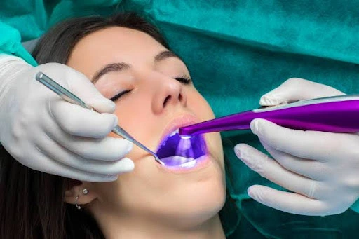 a woman getting her teeth examined
